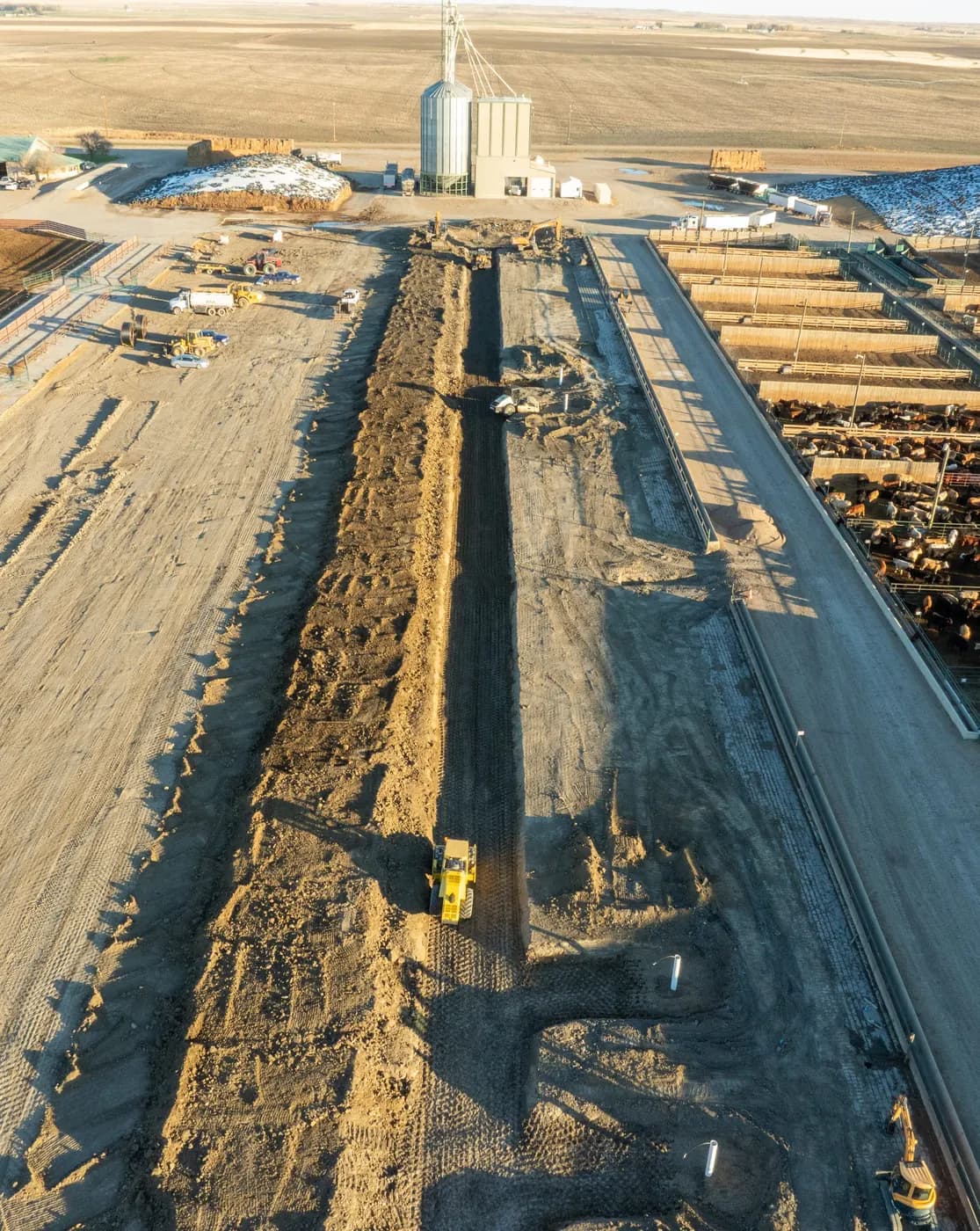 Aerial view of earthmoving work at an active Southern Alberta feedlot